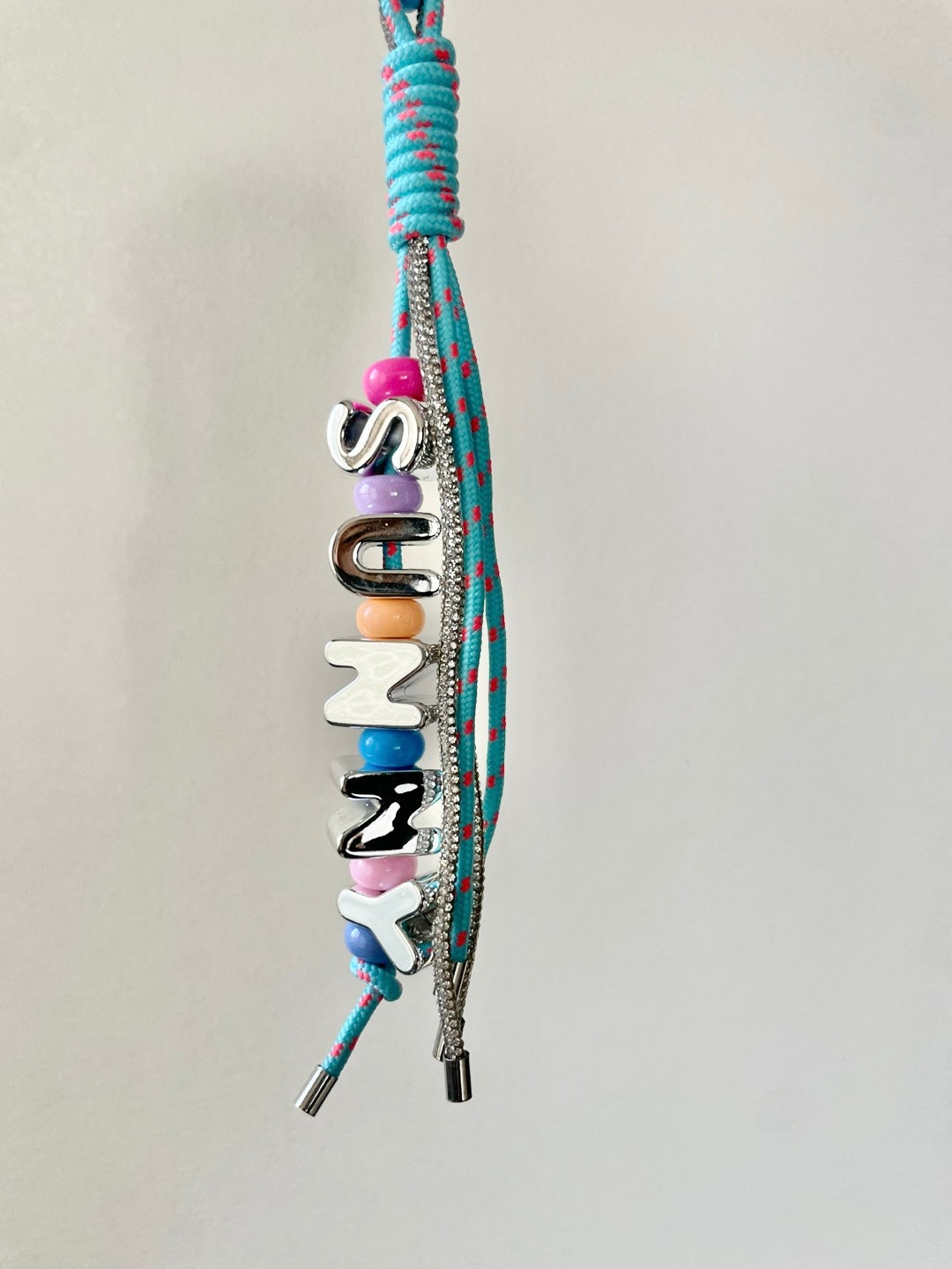 CRISTAL AND ROPE CHARM