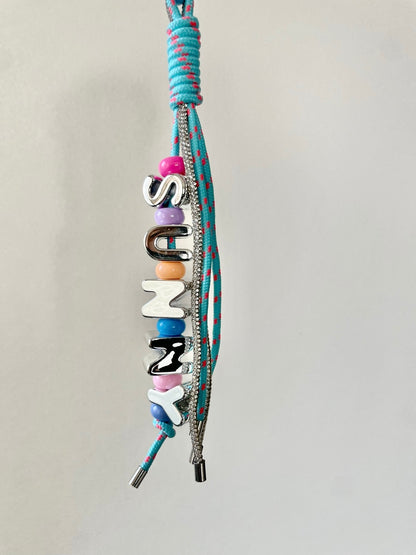 CRISTAL AND ROPE CHARM
